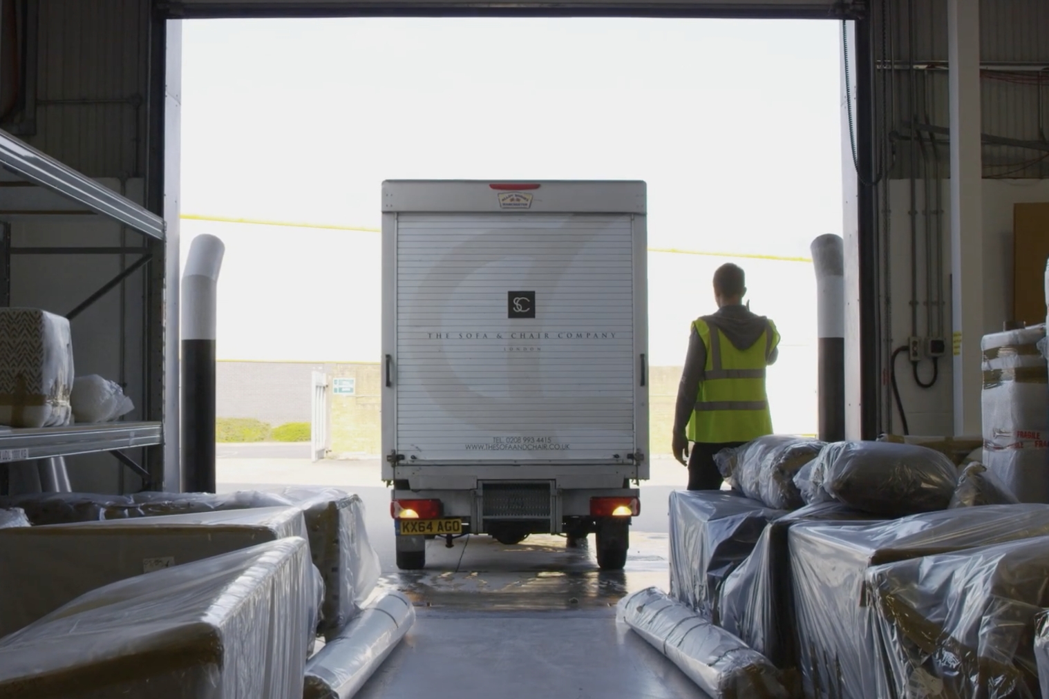 Delivery van entering warehouse
