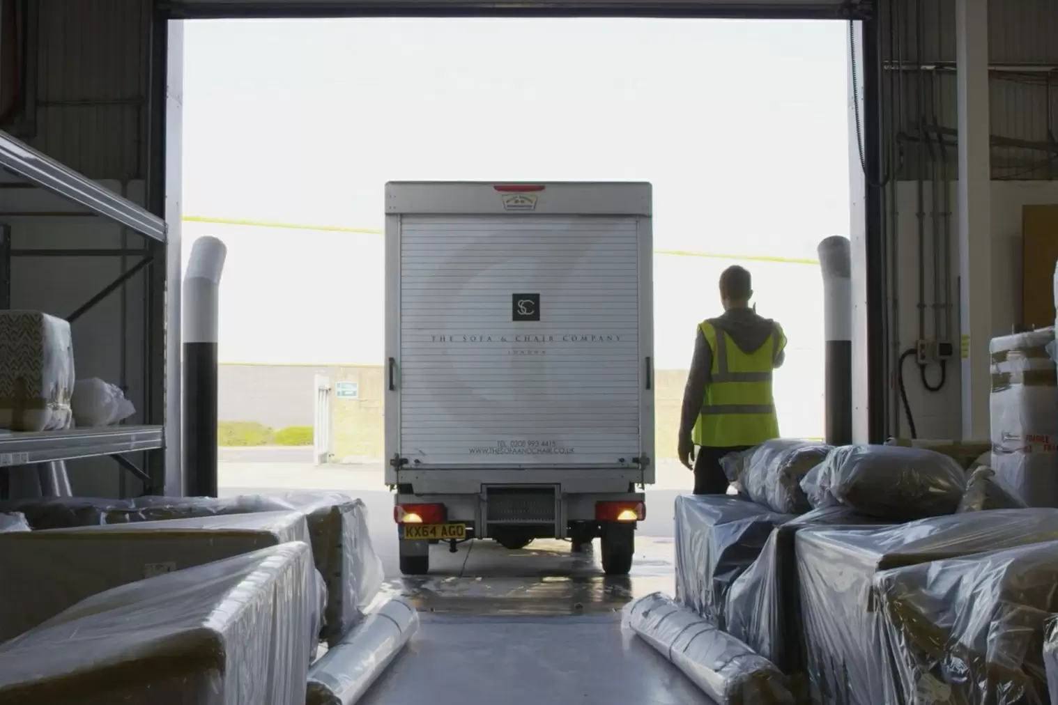 Delivery van entering warehouse